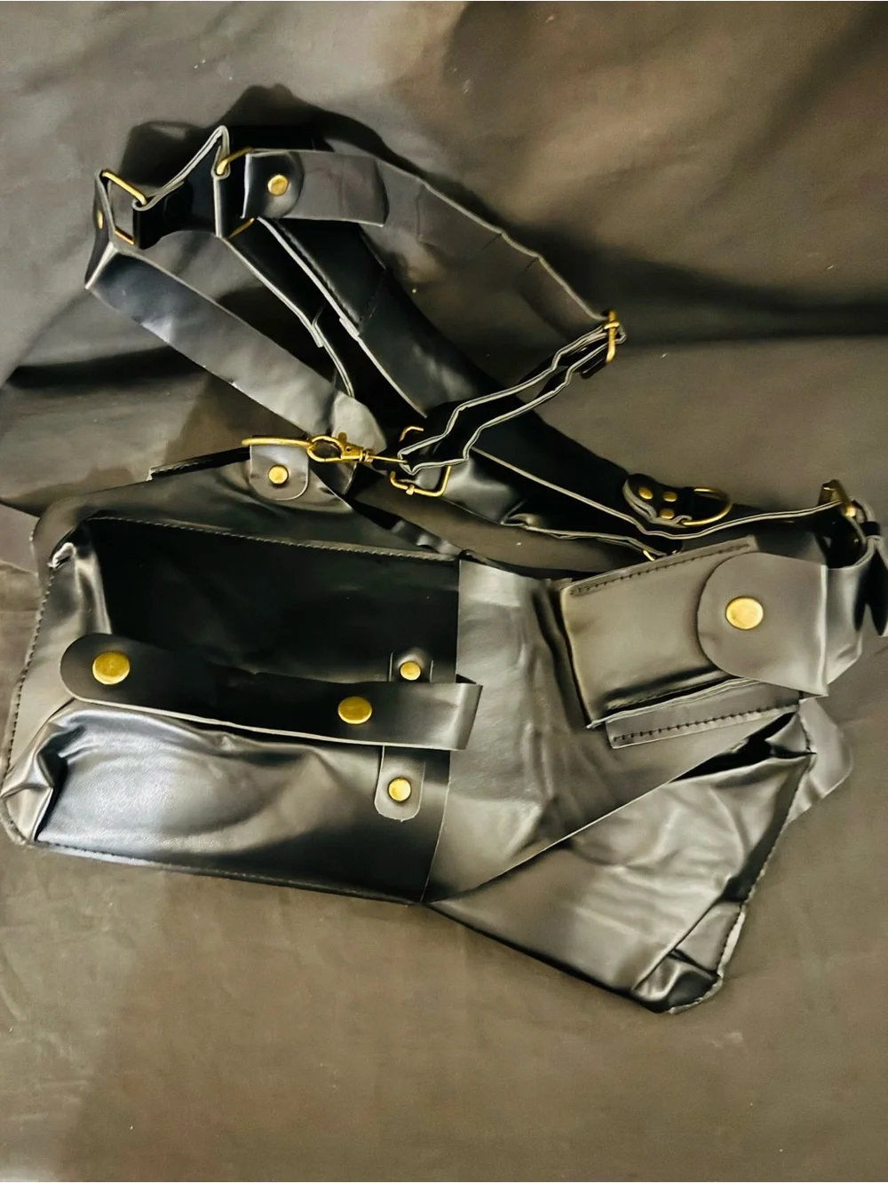 Black Leather Crossbody Harness Bag with Gold Hardware
